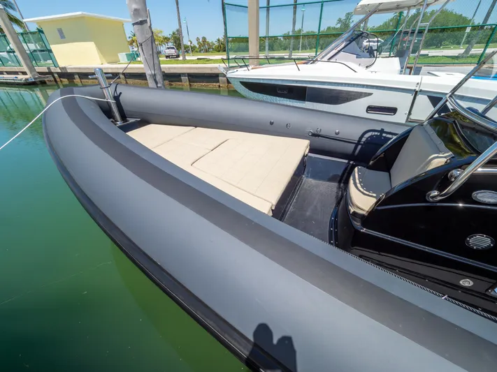  Yacht Photos Pics 2023 Sea Water PHANTOM 280 boat docked, featuring sleek design and spacious deck.