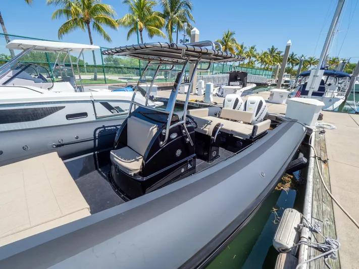  Yacht Photos Pics 2023 Sea Water PHANTOM 280 boat docked at marina with palm trees in background.