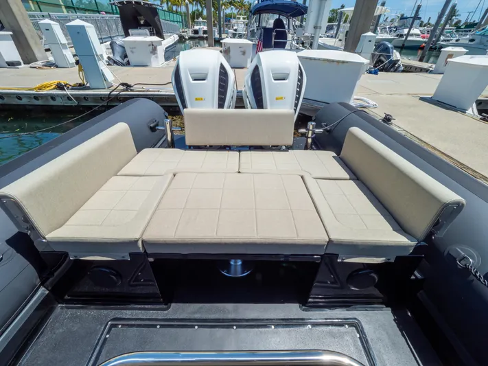  Yacht Photos Pics 2023 Sea Water PHANTOM 280 boat with spacious seating at a marina.