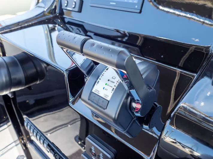  Yacht Photos Pics Close-up of Sea Water PHANTOM 280 boat controls, 2023 model, featuring sleek black design.
