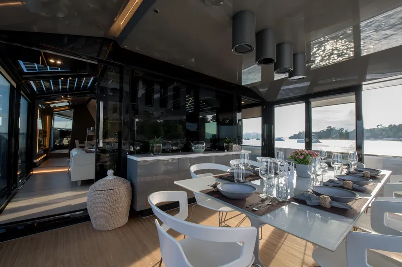 Marcello Yacht Photos Pics Luxurious dining area on 2015 Arcadia Yachts Arcadia 85, featuring elegant table settings and scenic views.