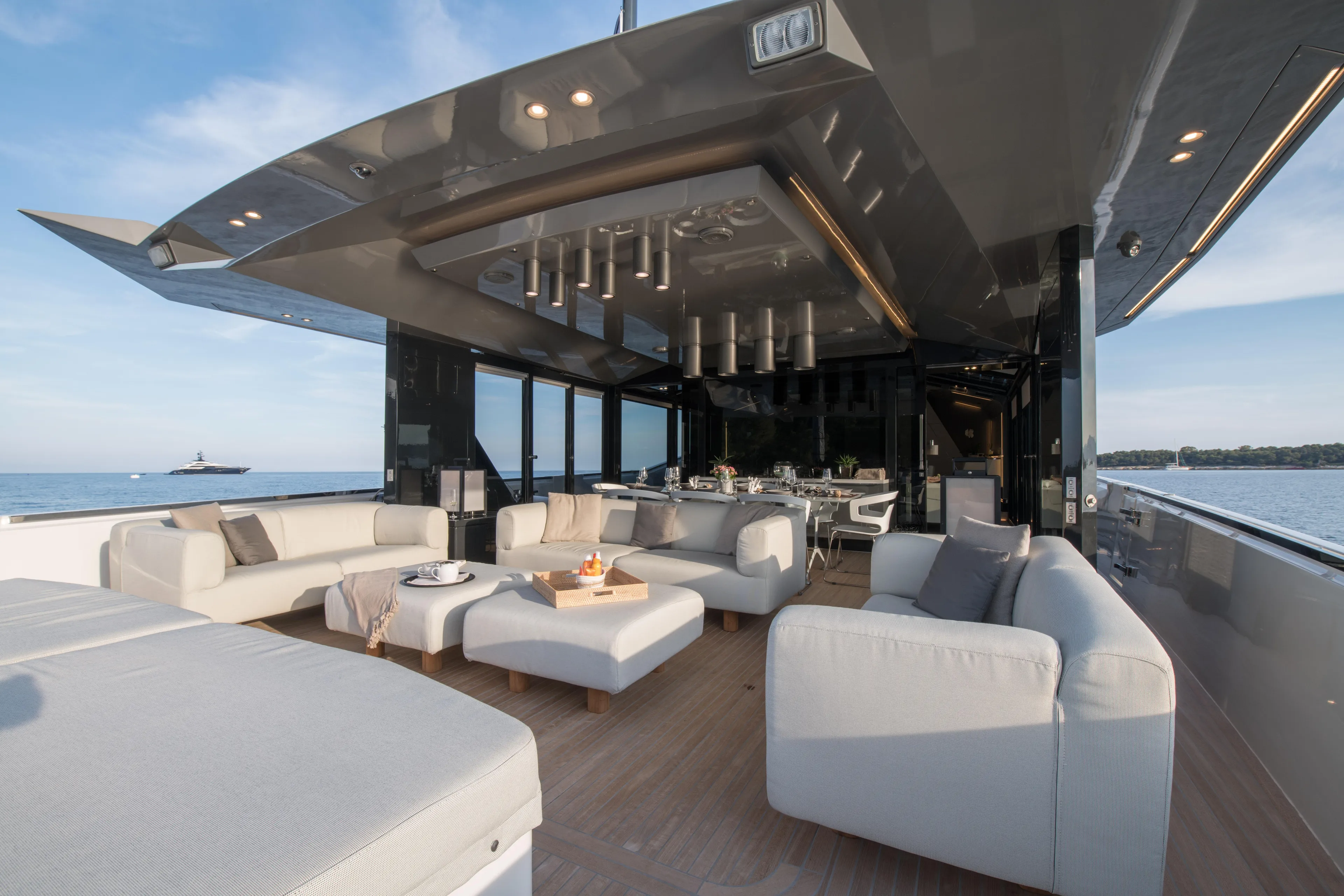 Marcello Yacht Photos Pics Luxurious 2015 Arcadia 85 yacht with elegant outdoor seating and ocean view.