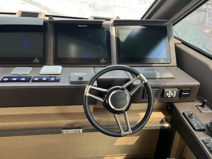  Yacht Photos Pics Steering wheel and control panel of 2017 Prestige 680 yacht cockpit.