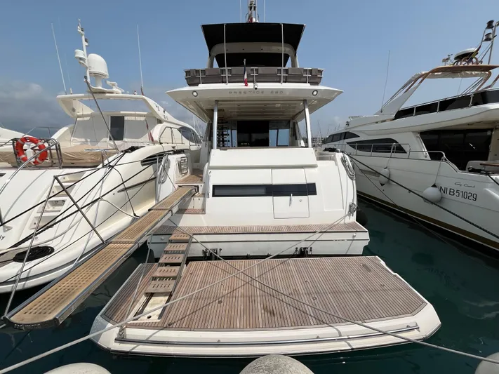  Yacht Photos Pics Luxury 2017 Prestige 680 yacht docked at marina, showcasing elegant design and spacious deck.