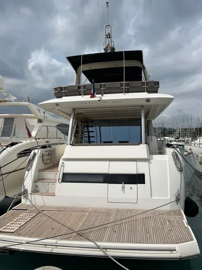  Yacht Photos Pics 2017 Prestige 680 yacht docked at marina under cloudy sky.
