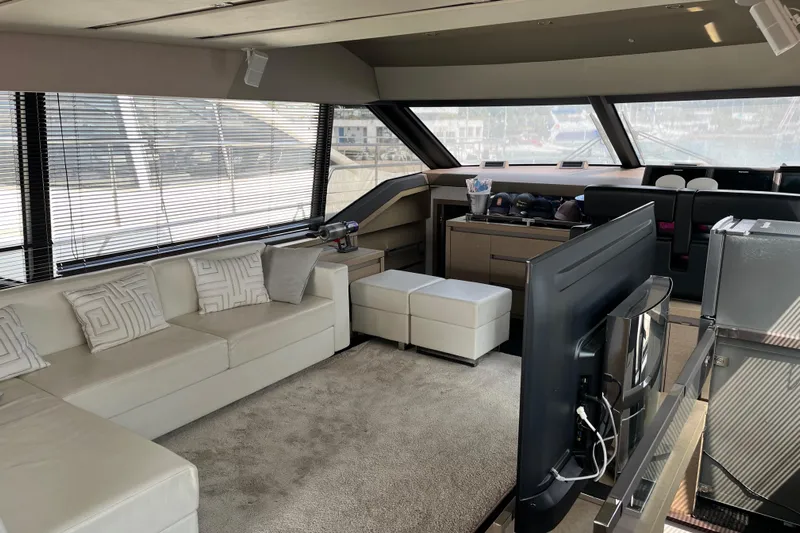  Yacht Photos Pics Luxurious interior of a 2017 Prestige 680 yacht with modern furnishings and panoramic windows.