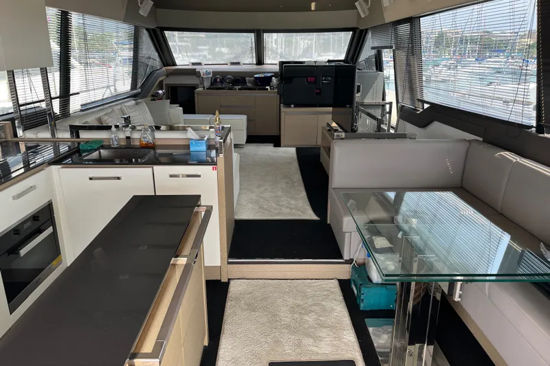  Yacht Photos Pics Luxurious interior of a 2017 Prestige 680 yacht with modern kitchen and seating area.