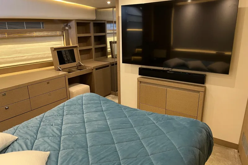  Yacht Photos Pics Luxurious bedroom in 2017 Prestige 680 yacht with TV and modern furnishings.