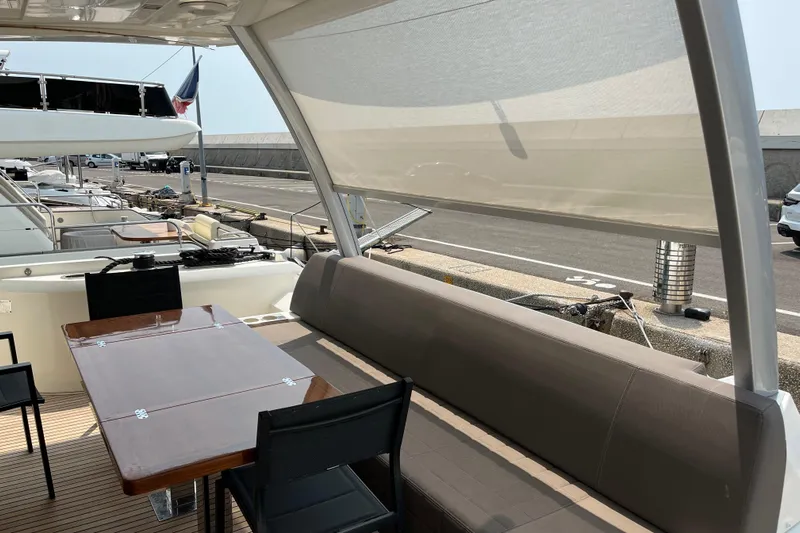  Yacht Photos Pics Luxurious 2017 Prestige 680 yacht deck with seating and dining area.