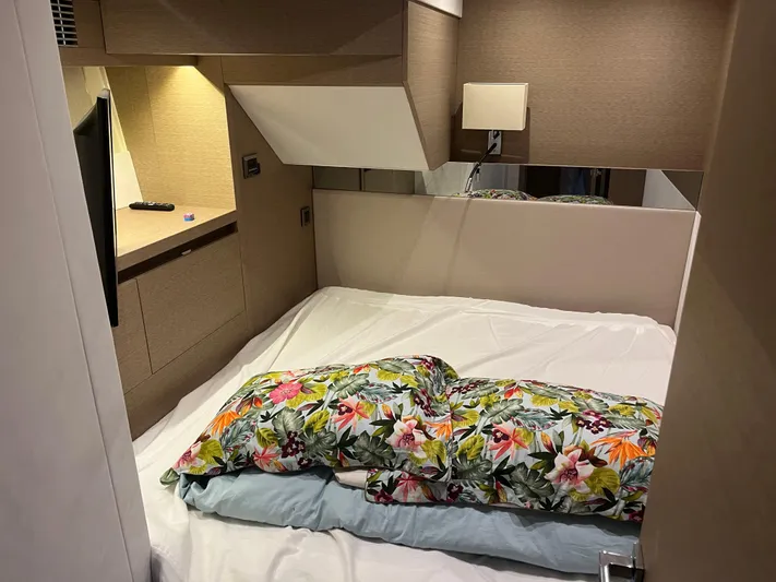  Yacht Photos Pics Cozy bedroom in 2017 Prestige 680 yacht with floral bedding and modern lighting.