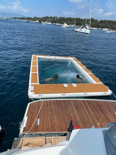  Yacht Photos Pics Floating pool attached to a 2017 Prestige 680 yacht in a scenic bay.