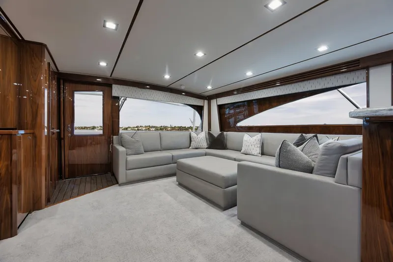  Yacht Photos Pics Luxurious interior of 2019 Viking 80 Convertible yacht with elegant seating and wood finishes.