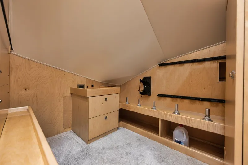  Yacht Photos Pics Interior of 2019 Viking 80 Convertible yacht with wooden cabinetry and storage space.