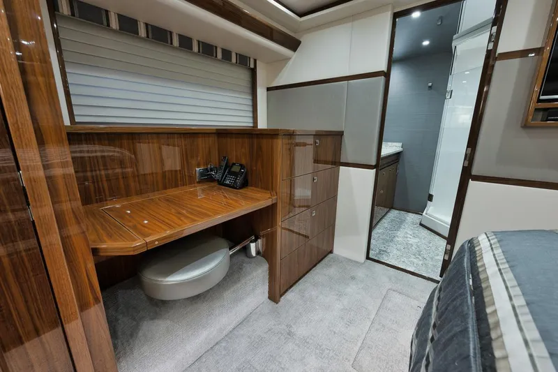  Yacht Photos Pics Luxurious interior of 2019 Viking 80 Convertible yacht with wood finishes and modern amenities.