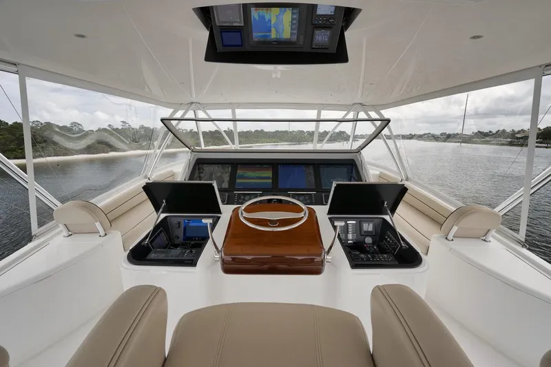  Yacht Photos Pics Interior view of 2019 Viking 80 Convertible yacht cockpit with advanced navigation systems.