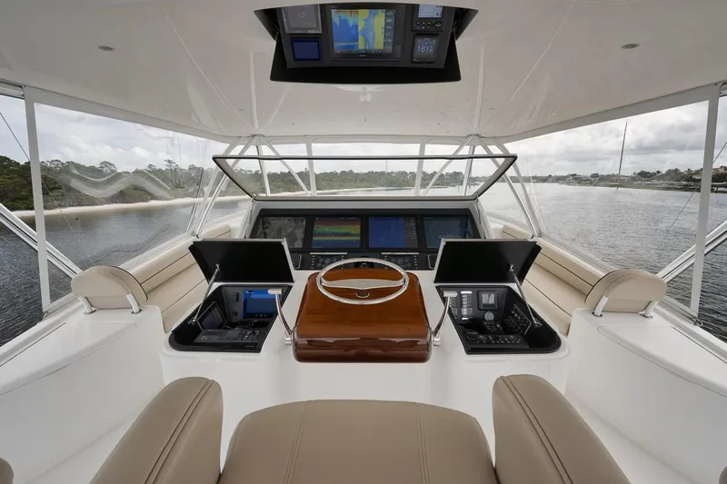  Yacht Photos Pics 2019 Viking 80 Convertible yacht helm with advanced navigation systems and panoramic water views.