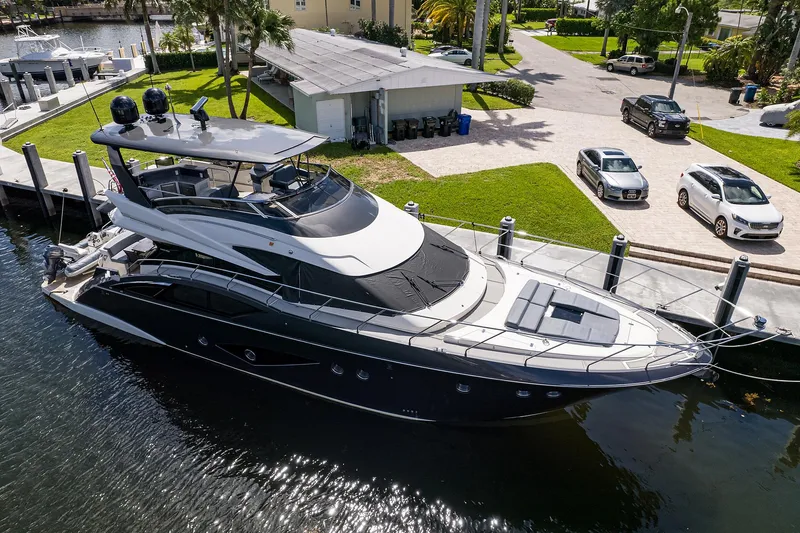 No Name 66 Marquis Yacht Photos Pics 2017 Marquis 660 Sport Yacht docked at a marina, showcasing sleek design and luxury features.