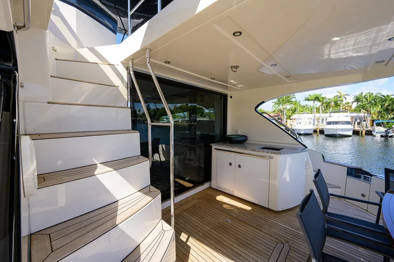 No Name 66 Marquis Yacht Photos Pics 2017 Marquis 660 Sport Yacht deck with stairs, seating, and waterfront view.