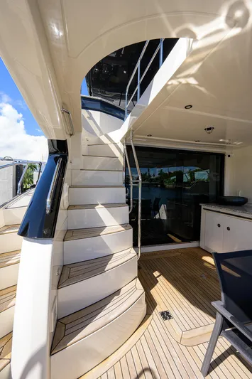 No Name 66 Marquis Yacht Photos Pics Staircase on 2017 Marquis 660 Sport Yacht, leading to upper deck, with sleek design.