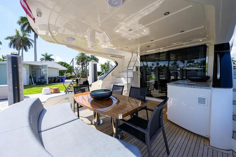 No Name 66 Marquis Yacht Photos Pics Luxurious 2017 Marquis 660 Sport Yacht deck with seating and dining area.