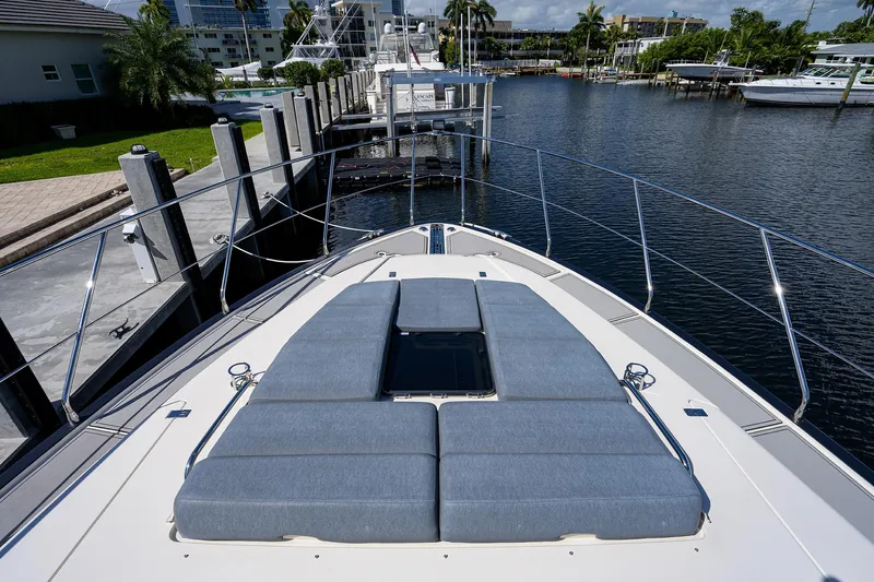 No Name 66 Marquis Yacht Photos Pics 2017 Marquis 660 Sport Yacht with sunbathing deck, docked at a marina.