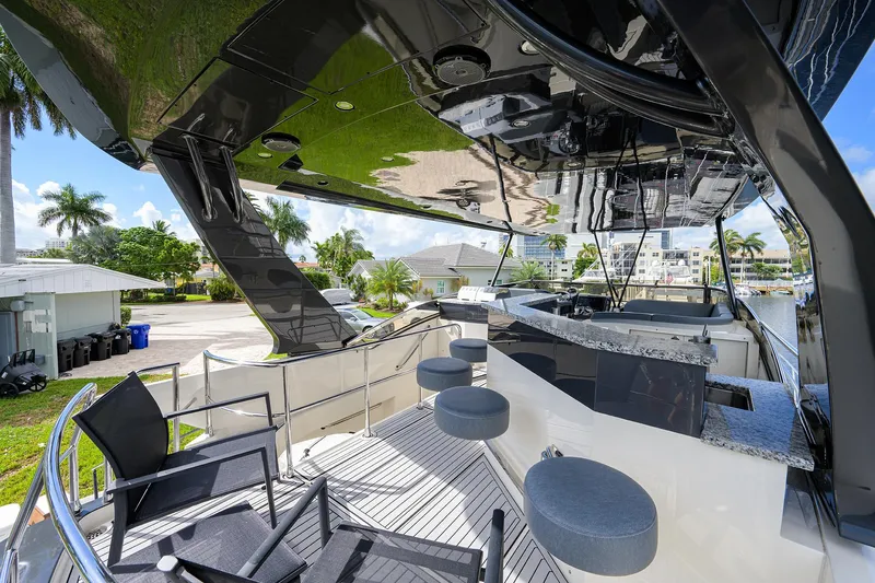 No Name 66 Marquis Yacht Photos Pics Luxurious 2017 Marquis 660 Sport Yacht deck with seating and bar area.