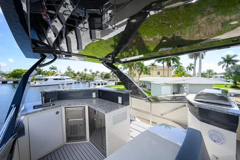 No Name 66 Marquis Yacht Photos Pics Luxurious 2017 Marquis 660 Sport Yacht deck with modern amenities and waterfront view.