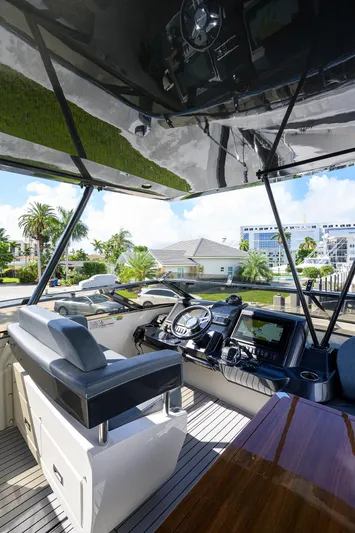 No Name 66 Marquis Yacht Photos Pics Interior view of 2017 Marquis 660 Sport Yacht cockpit with modern controls.