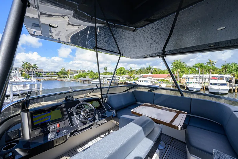 No Name 66 Marquis Yacht Photos Pics 2017 Marquis 660 Sport Yacht interior with helm, seating, and waterfront view.