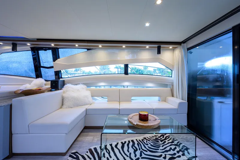 No Name 66 Marquis Yacht Photos Pics Luxurious interior of 2017 Marquis 660 Sport Yacht with modern white seating and glass table.
