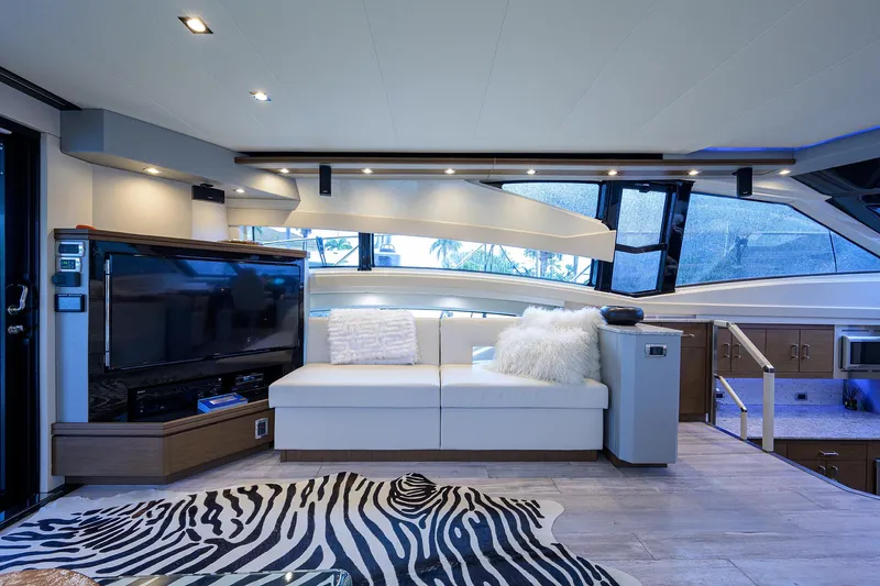 No Name 66 Marquis Yacht Photos Pics Luxurious interior of 2017 Marquis 660 Sport Yacht with modern decor and zebra-patterned rug.