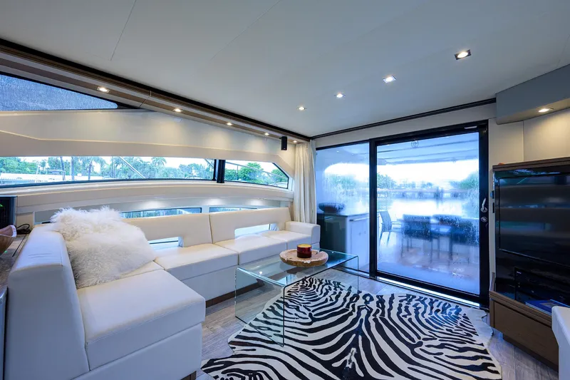 No Name 66 Marquis Yacht Photos Pics Luxurious interior of 2017 Marquis 660 Sport Yacht with modern decor and zebra-patterned rug.
