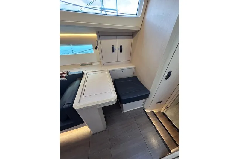 Chase'n Grace Yacht Photos Pics Interior of 2022 Jeanneau Yachts 60, featuring seating and cabinetry.