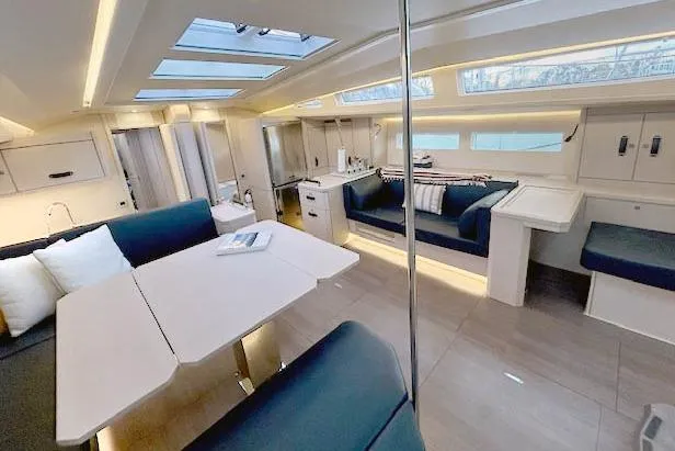 Chase'n Grace Yacht Photos Pics Luxurious interior of 2022 Jeanneau Yachts 60 with modern seating and skylights.