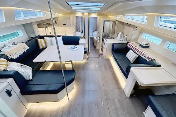 Chase'n Grace Yacht Photos Pics Luxurious interior of 2022 Jeanneau Yachts 60 with modern seating and ambient lighting.