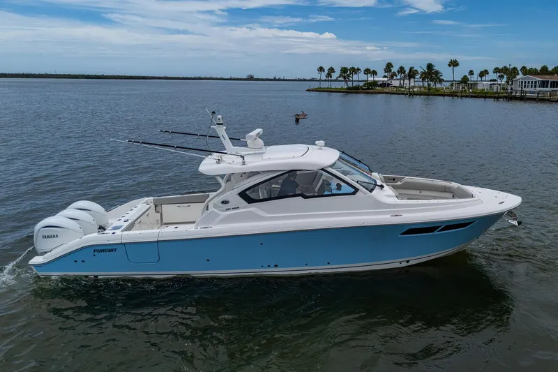  Yacht Photos Pics 2023 Pursuit DC 365 Dual Console boat on calm water, featuring Yamaha engines.