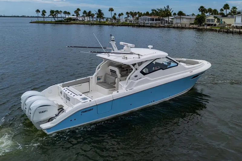  Yacht Photos Pics 2023 Pursuit DC 365 Dual Console boat on calm water, featuring triple Yamaha engines.