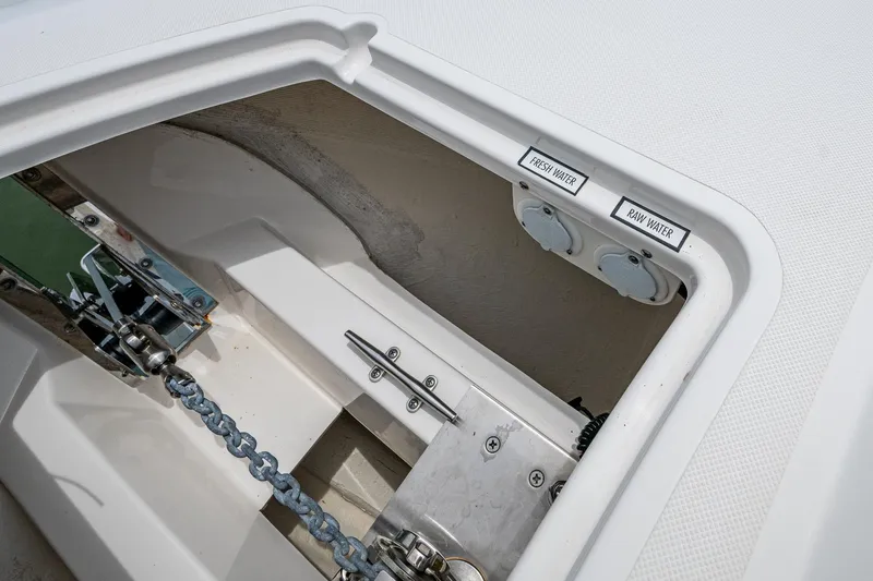  Yacht Photos Pics 2023 Pursuit DC 365 Dual Console anchor compartment with fresh and raw water outlets.