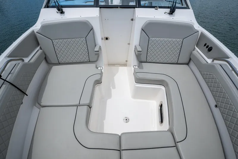  Yacht Photos Pics 2023 Pursuit DC 365 Dual Console boat interior with luxurious seating and elegant design.