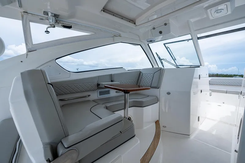  Yacht Photos Pics 2023 Pursuit DC 365 Dual Console interior with sleek seating and modern design.