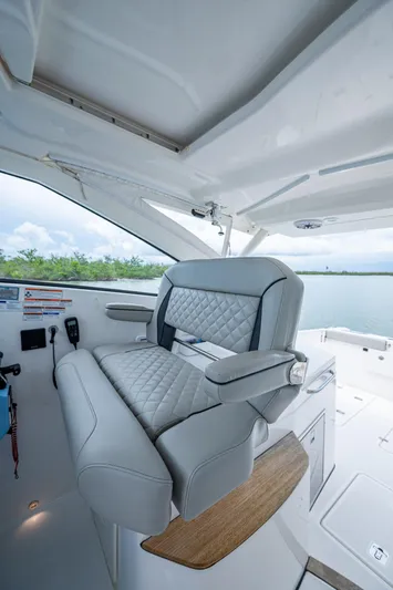 Yacht Photos Pics 2023 Pursuit DC 365 Dual Console boat interior with luxurious seating and modern design.