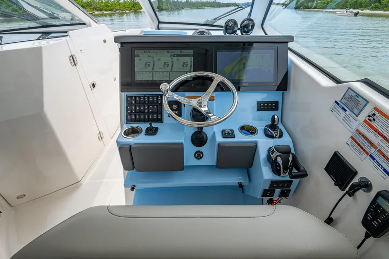  Yacht Photos Pics 2023 Pursuit DC 365 Dual Console helm with modern controls and navigation screens.