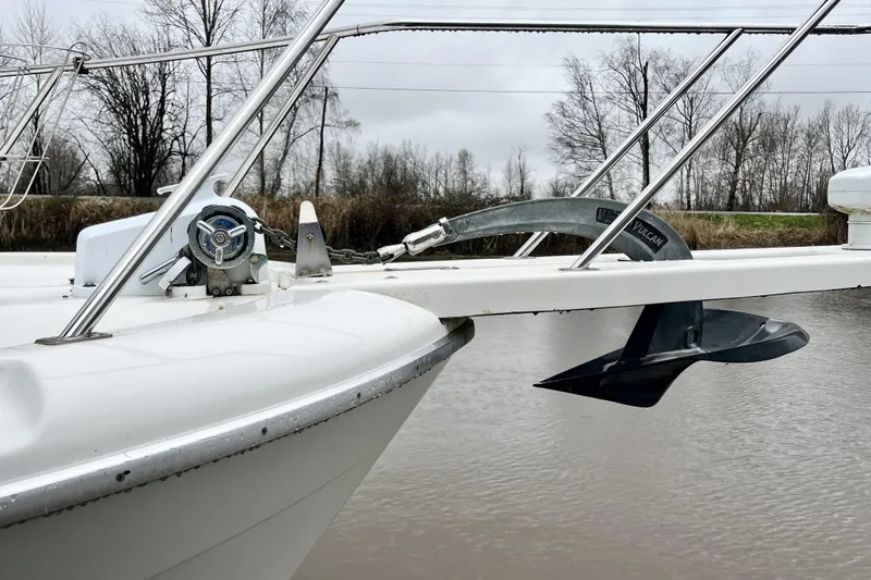  Yacht Photos Pics 1996 Bayliner 3988 Motoryacht bow with anchor and railing on a cloudy day.