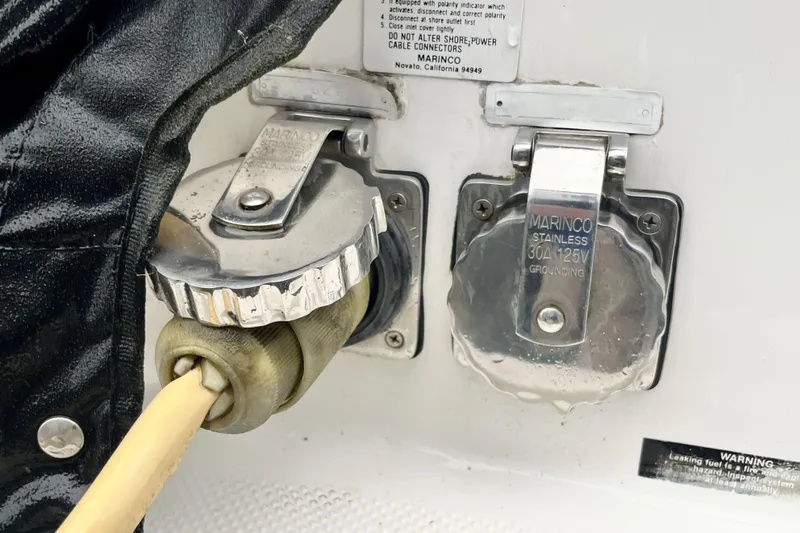  Yacht Photos Pics Power connectors on a 1996 Bayliner 3988 Motoryacht, featuring Marinco stainless steel covers.