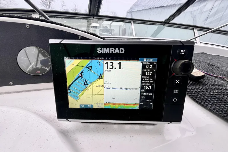  Yacht Photos Pics Simrad navigation system on 1996 Bayliner 3988 Motoryacht dashboard, displaying nautical map.