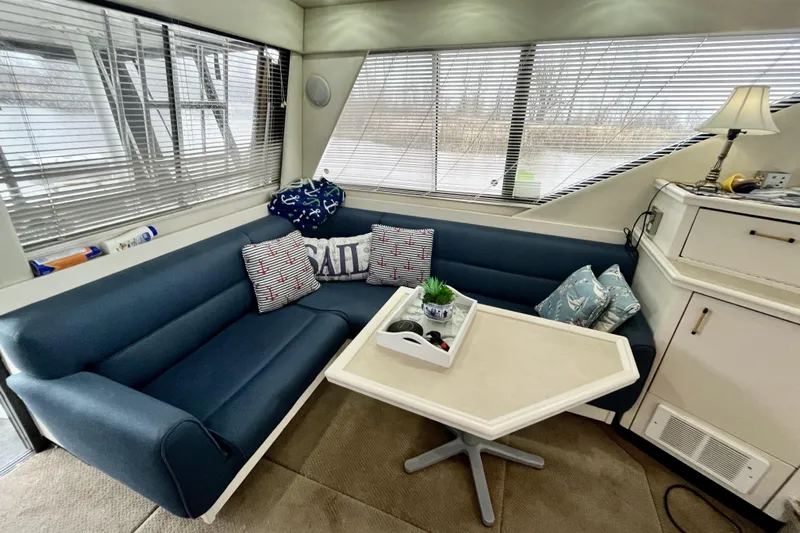  Yacht Photos Pics Interior of 1996 Bayliner 3988 Motoryacht with blue seating and nautical decor.