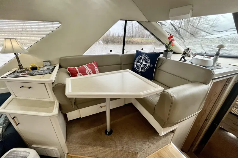  Yacht Photos Pics Interior of 1996 Bayliner 3988 Motoryacht with cozy seating and nautical decor.