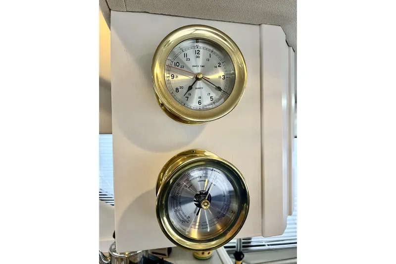  Yacht Photos Pics Gold-framed clock and barometer on 1996 Bayliner 3988 Motoryacht interior.