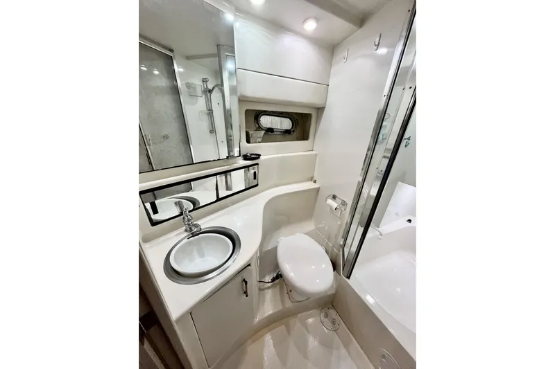  Yacht Photos Pics Bathroom interior of 1996 Bayliner 3988 Motoryacht with sink, toilet, and shower.