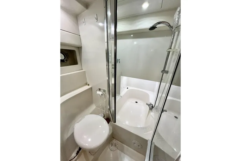  Yacht Photos Pics Bathroom interior of 1996 Bayliner 3988 Motoryacht with shower and toilet.